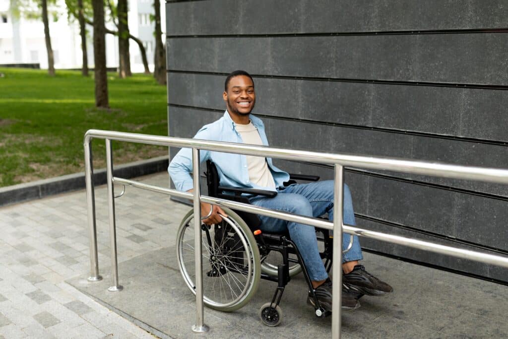 man in wheelchair using ramp